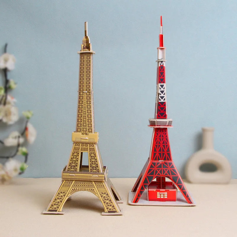 Model of the Eiffel Tower and Tokyo Tower on a light blue background