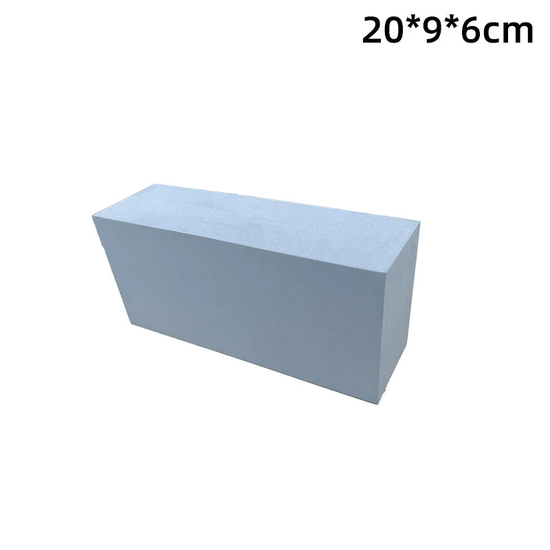 Rectangular block of light blue foam with dimensions 20*9*6cm on a white background