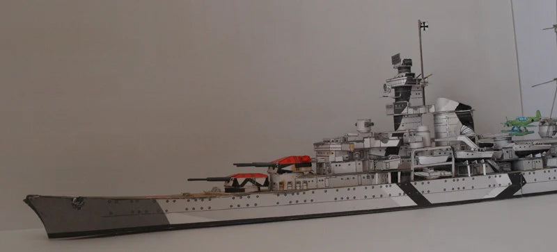 Model of a battleship on a plain background