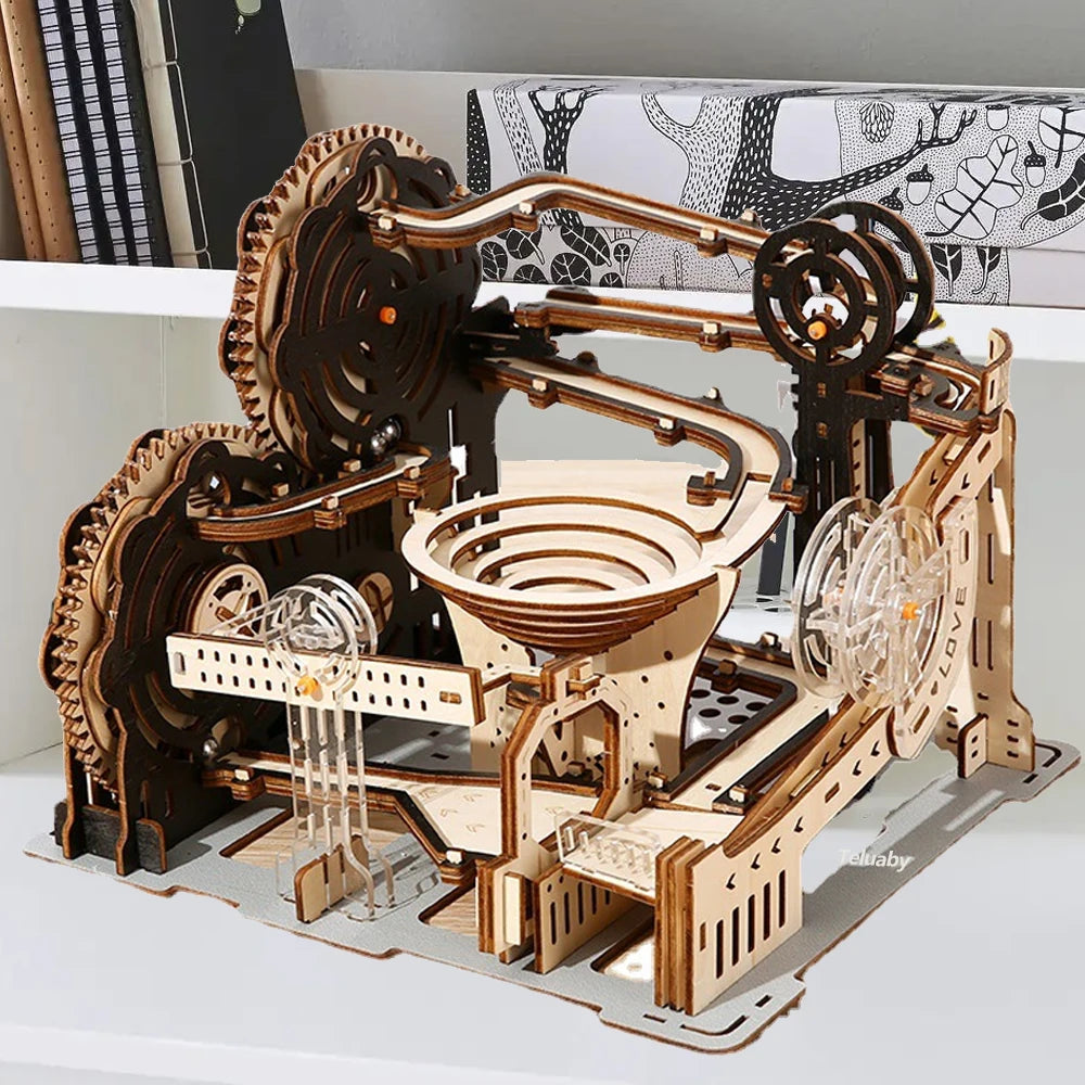 Wooden mechanical model kit on a white surface with a decorative wall in the background